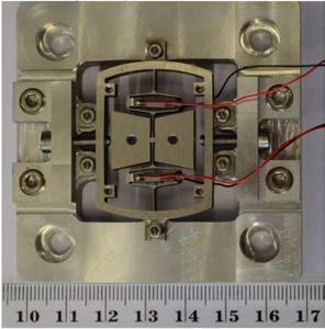 A bistable piezoelectric harvester for wideband mechanical frequency excitation
